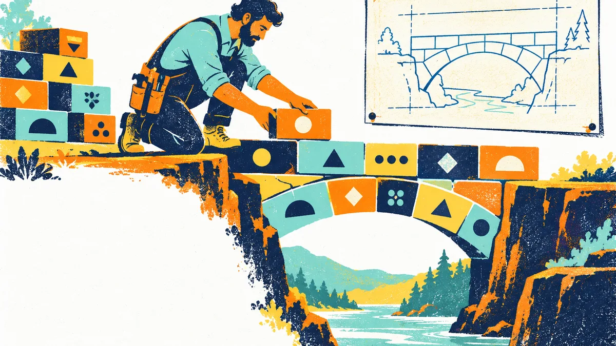 Tarjetas con patrones geométricos sobre un escritorio, junto a una computadora cuya pantalla muestra código desenfocado